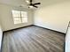 Light-filled bedroom with a ceiling fan and window that provides natural light at 6159 Sable Fox Dr, Riverdale, GA 30296