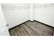 Walk-in closet with wooden floor and white wire shelving at 6159 Sable Fox Dr, Riverdale, GA 30296