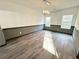 Dining room featuring modern lighting, neutral walls, and laminate flooring at 6159 Sable Fox Dr, Riverdale, GA 30296