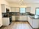 Well-equipped kitchen featuring granite countertops and stainless steel appliances at 6159 Sable Fox Dr, Riverdale, GA 30296