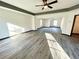 Large living room with hardwood flooring, high ceilings, and natural light at 6159 Sable Fox Dr, Riverdale, GA 30296