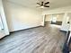 Open-concept living room with new laminate floors and ample natural light at 6159 Sable Fox Dr, Riverdale, GA 30296