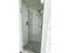Modern shower with glass enclosure and hexagon tile floor adds elegance at 6159 Sable Fox Dr, Riverdale, GA 30296