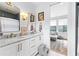 Stylish bathroom featuring double vanities, marble countertops, and gold fixtures at 289 2Nd St, Fayetteville, GA 30214