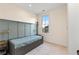 Small bedroom featuring hardwood floors, a modern headboard, and a light-filled window at 289 2Nd St, Fayetteville, GA 30214
