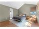 Comfortable bedroom featuring hardwood floors, neutral walls, and a sunlit window seat at 289 2Nd St, Fayetteville, GA 30214