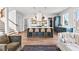 Open-concept kitchen with island seating, stainless steel appliances, and hardwood floors at 289 2Nd St, Fayetteville, GA 30214