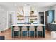 Modern kitchen with a large island, white countertops, and stylish pendant lighting at 289 2Nd St, Fayetteville, GA 30214