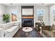 Elegant living room showcasing a fireplace with a decorative mirror and a comfortable sofa at 289 2Nd St, Fayetteville, GA 30214