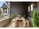 Inviting brick porch features stylish seating with striped cushions and green potted plants at 289 2Nd St, Fayetteville, GA 30214