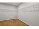 Empty closet with wire shelving and light wood floors at 1692 Juniper Berry Way, Loganville, GA 30052