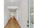 Bright hallway featuring wood flooring, leading to other areas of the home, with natural light streaming in at 1692 Juniper Berry Way, Loganville, GA 30052