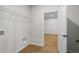 Laundry room with wire shelving and light wood floors at 1692 Juniper Berry Way, Loganville, GA 30052