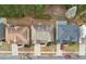 An aerial view of suburban homes, featuring a close up of roofs, driveways, and landscaping, showcasing residential architecture at 2126 Roberts View Trl, Buford, GA 30519