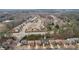 An aerial shot displays the layout of suburban homes and green spaces, underlining the area's tranquil atmosphere at 2126 Roberts View Trl, Buford, GA 30519