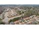 An aerial view of homes nestled among trees, emphasizing the neighborhood's blend of natural beauty and community living at 2126 Roberts View Trl, Buford, GA 30519