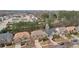 An aerial view of suburban homes featuring manicured lawns, long driveways, and beautiful trees, creating a peaceful neighborhood at 2126 Roberts View Trl, Buford, GA 30519