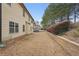 Spacious backyard, with a retaining wall, offering ample space for outdoor activities at 2126 Roberts View Trl, Buford, GA 30519