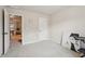 Neutral bedroom featuring carpeted floors and ample natural light from an open doorway at 2126 Roberts View Trl, Buford, GA 30519