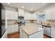 Bright, modern kitchen featuring granite countertops, stainless steel appliances, and ample cabinet space at 2126 Roberts View Trl, Buford, GA 30519