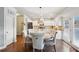 Eat-in kitchen features a round table, modern light fixture and leads into a fully appointed kitchen at 2126 Roberts View Trl, Buford, GA 30519