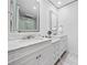 Elegant bathroom featuring double sinks with marble countertops and modern lighting at 2826 Cobb Place Manor Ct, Marietta, GA 30066