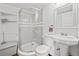 Modern bathroom featuring a glass-enclosed shower, a toilet, and a pedestal sink at 2826 Cobb Place Manor Ct, Marietta, GA 30066
