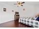 Cozy bedroom with hardwood floors, a ceiling fan, and a neutral color scheme at 2826 Cobb Place Manor Ct, Marietta, GA 30066
