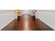 Finished bonus room with hardwood floors and built-in shelving for storage and decor at 2826 Cobb Place Manor Ct, Marietta, GA 30066