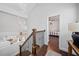 Upstairs hallway with staircase and view into bedroom and kitchen at 2826 Cobb Place Manor Ct, Marietta, GA 30066