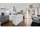 Well-lit kitchen with island, stainless appliances, and hardwood floors, adjoining dining area and backyard access at 2826 Cobb Place Manor Ct, Marietta, GA 30066