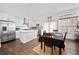 Bright kitchen with stainless steel appliances, island with marble countertop, and hardwood floors at 2826 Cobb Place Manor Ct, Marietta, GA 30066