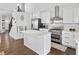 Modern kitchen featuring stainless steel appliances, island with white countertop, and ample cabinetry at 2826 Cobb Place Manor Ct, Marietta, GA 30066