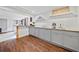 Finished basement kitchenette with a granite countertop, and wood style flooring at 2826 Cobb Place Manor Ct, Marietta, GA 30066