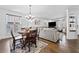Comfortable living room with hardwood floors, chandelier lighting, and a view of the front windows at 2826 Cobb Place Manor Ct, Marietta, GA 30066