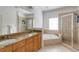 Spacious bathroom includes a granite countertop vanity, a walk-in shower, and a large soaking tub at 1175 Glenridge Pl, Atlanta, GA 30342