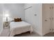 Compact bedroom showcases a cozy bed, a side table, and a closet with mirrored sliding doors at 1175 Glenridge Pl, Atlanta, GA 30342