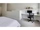 A functional workspace is part of this bedroom, featuring sleek, built-in shelving and a modern chair at 1175 Glenridge Pl, Atlanta, GA 30342