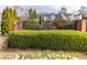 Community sign for Glenridge Creek Townhomes set amongst lush landscaping at 1175 Glenridge Pl, Atlanta, GA 30342