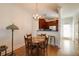 Inviting dining area adjacent to the kitchen, featuring a classic chandelier and hardwood floors at 1175 Glenridge Pl, Atlanta, GA 30342