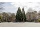 Community entrance with manicured greenery and security gate at 1175 Glenridge Pl, Atlanta, GA 30342