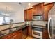 Well-equipped kitchen with stainless steel appliances, granite countertops, and an open view to the living area at 1175 Glenridge Pl, Atlanta, GA 30342