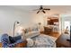 Comfortable living room with white sofa, hardwood floors, and view of the open-concept kitchen and dining area at 1175 Glenridge Pl, Atlanta, GA 30342