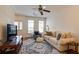 Cozy living room featuring neutral tones, hardwood floors, and large windows for natural light at 1175 Glenridge Pl, Atlanta, GA 30342