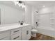 Bright bathroom features a single sink vanity and shower with black hardware at 5384 Heron Bay Blvd, Locust Grove, GA 30248