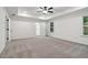 A spacious bedroom with ceiling fan, recessed lights, and large windows at 5384 Heron Bay Blvd, Locust Grove, GA 30248