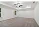 A bedroom with plush neutral carpet, recessed lighting, and white trim at 5384 Heron Bay Blvd, Locust Grove, GA 30248