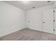 This bedroom has a cozy carpet and two doors at 5384 Heron Bay Blvd, Locust Grove, GA 30248