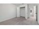 Bedroom with open closet for storage and carpeted floor at 5384 Heron Bay Blvd, Locust Grove, GA 30248