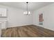 Modern dining room with hardwood floors and a modern chandelier at 5384 Heron Bay Blvd, Locust Grove, GA 30248
